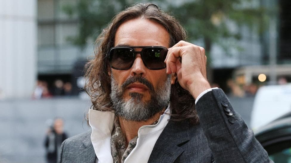 British actor and comedian Russell Brand arrives at Southwark Crown Court, where he is due to stand trial on charges of rape and sexual assault relating to six women, which he denies, in London, Britain, October 12, 2026.