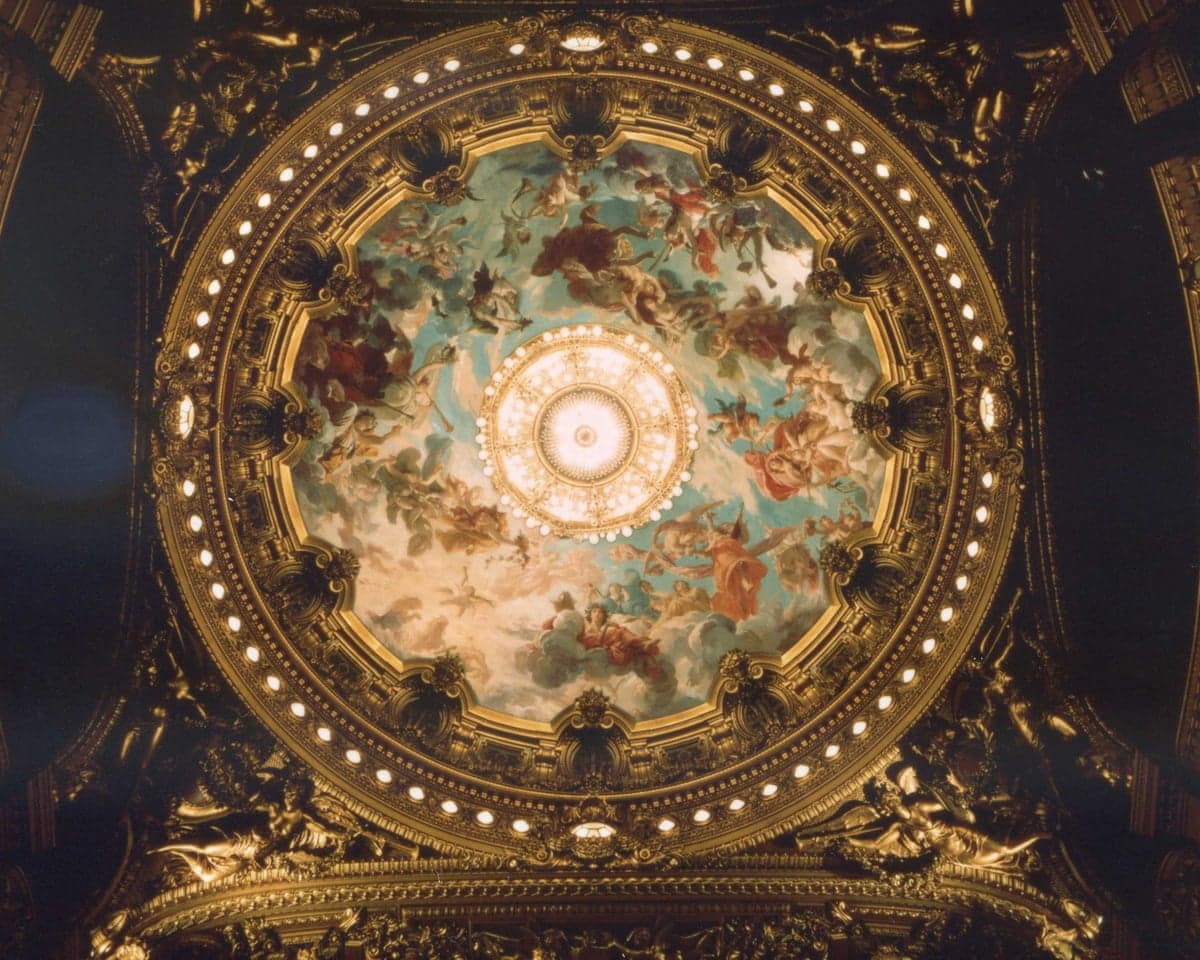 The hidden Lenepveu opera ceiling, with painted figures, gold decoration and chandelier