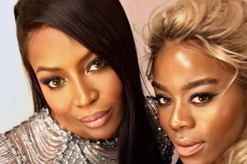A selfie of Antonia with model Naomi Campbell. The pair and close together and smiling at the camera. Naomi's hair is sleek, dark and long.