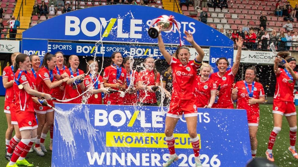 Cliftonville players celebrate with the League Cup
