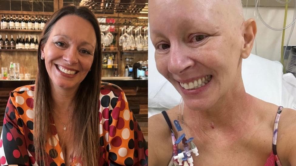 This image is a composite of two pictures of Caroline. In the picture on the left, she is smiling at the camera in a restaurant setting. She has long brunette hair and dark eyes. she is wearing a spotty blouse in various shades of pink, brown, orange and white. In the picture on the right, she is seen smiling in a selfie sat in a hospital bed. She is bald, with medical tubing and catheter lines behind her ear and going down her left shoulder