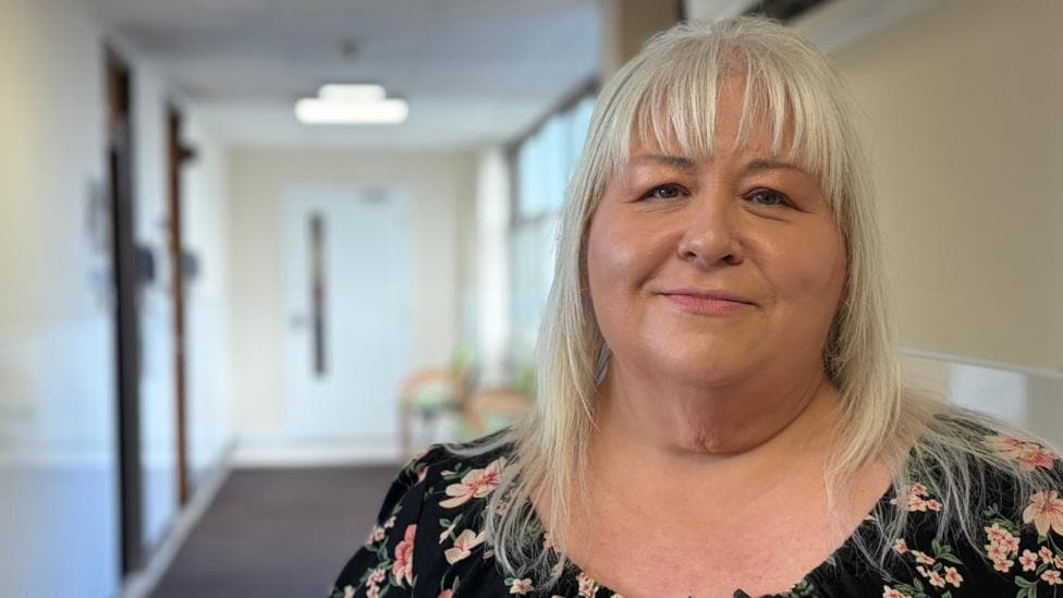 Kathleen McLaughlin with blonde hair and a flowery top has lost 4 stone on NHS Forth Valley's trial of weight loss drugs