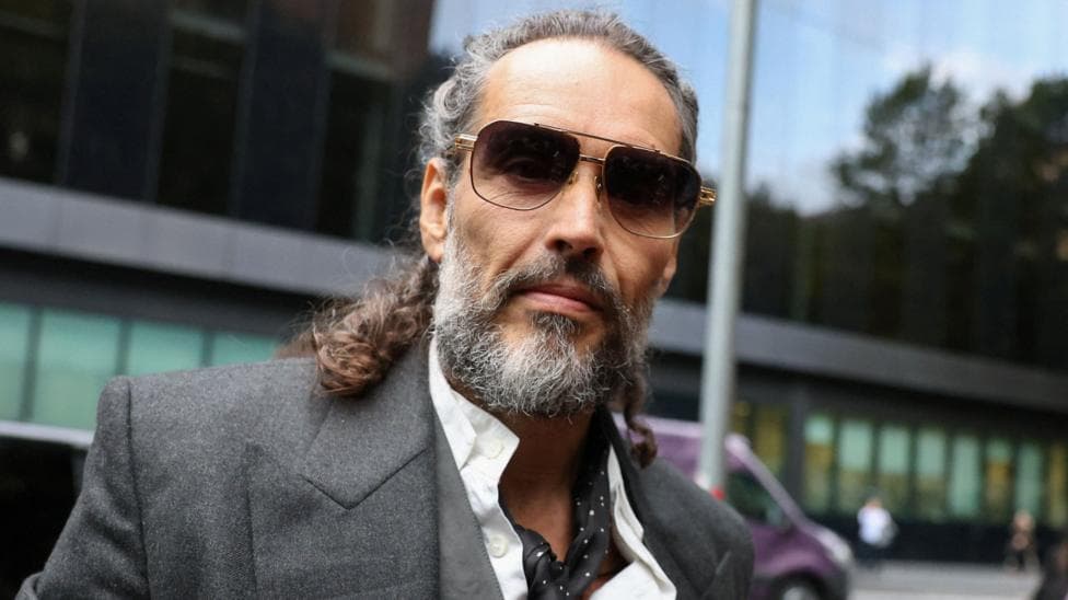 British actor and comedian Russell Brand arrives at Southwark Crown Court where he stands trial on charges of rape and sexual assault involving six women between 1999 and 2009, which he denies, in London, Britain, October 15, 2026