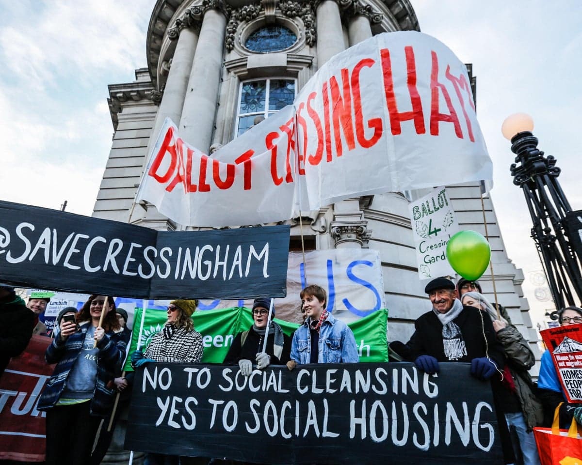Campaigners with banners outside Lambeth town hall calling for their homes to be saved