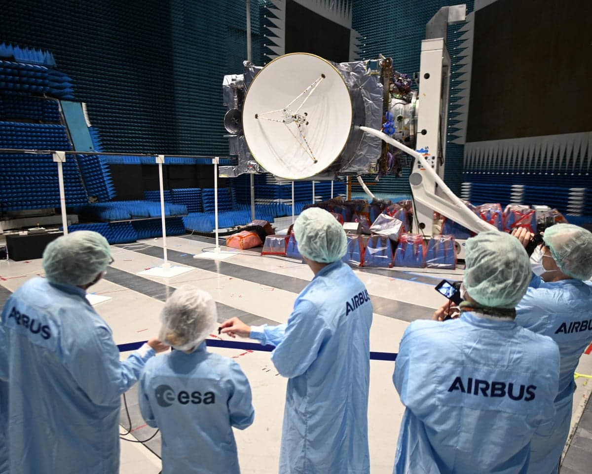 Airbus and ESA staff observe a spacecraft's dish antenna