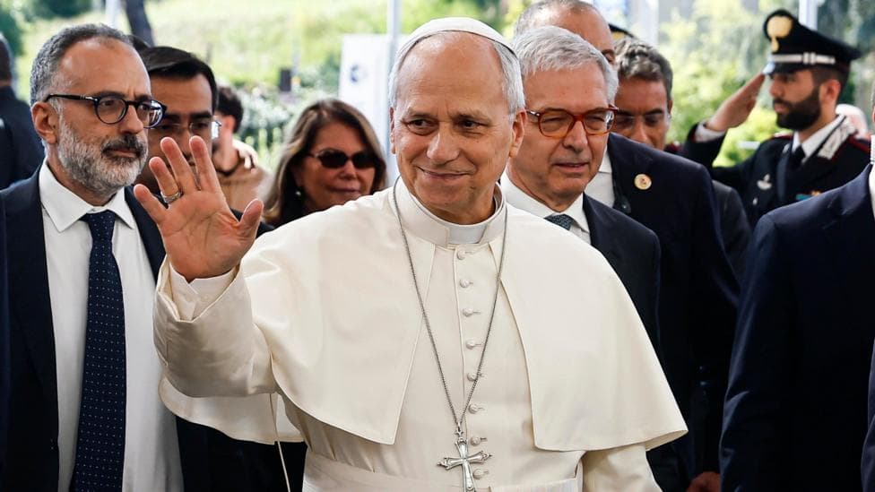 Pope Leo XIV waves as he arrives at the Agostino Gemelli University Hospital in Rome