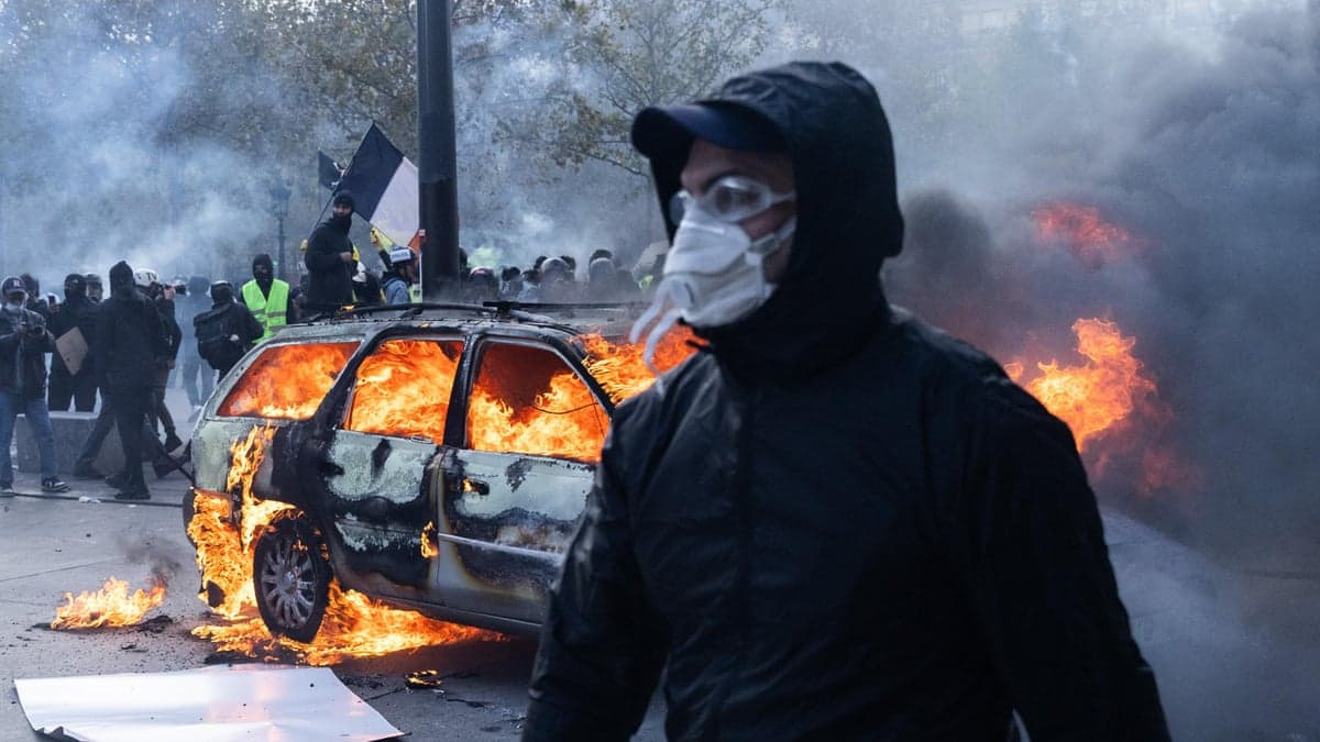 French Republican Security Corps officers clash with protesters during a demonstration on Place de la Republique in Paris