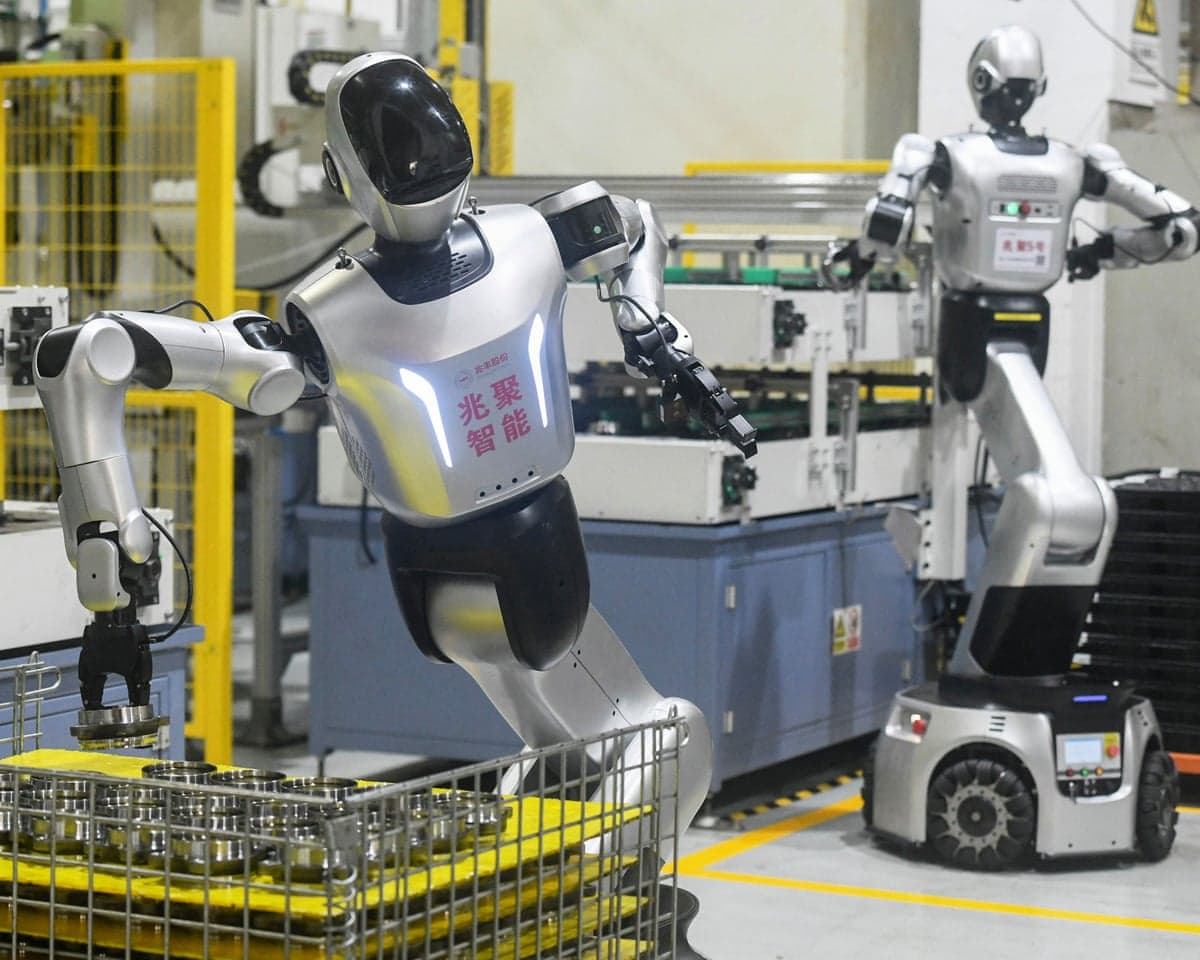 Humanoid robots from Leju Robotics work on an automobile wheel hub bearing production line at Zhejiang Zhaofeng Mechanical and Electronic's factory in Hangzhou, in eastern China's Zhejiang province on 19 October.