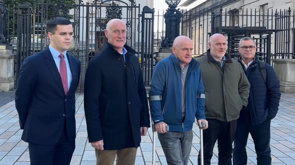 Five men lined up together.