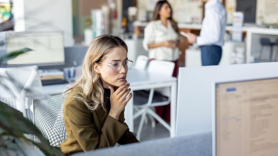 A woman works in an office - stock shot
