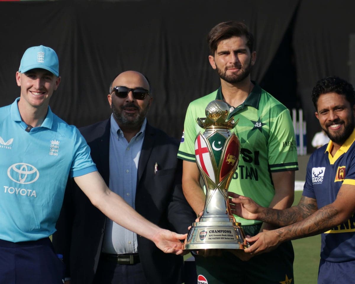 Pakistan's captain Shaheen Shah Afridi (centre), Sri Lanka's captain Kusal Mendis (right) and England's captain Harry Brook (left) pose with the series trophy.