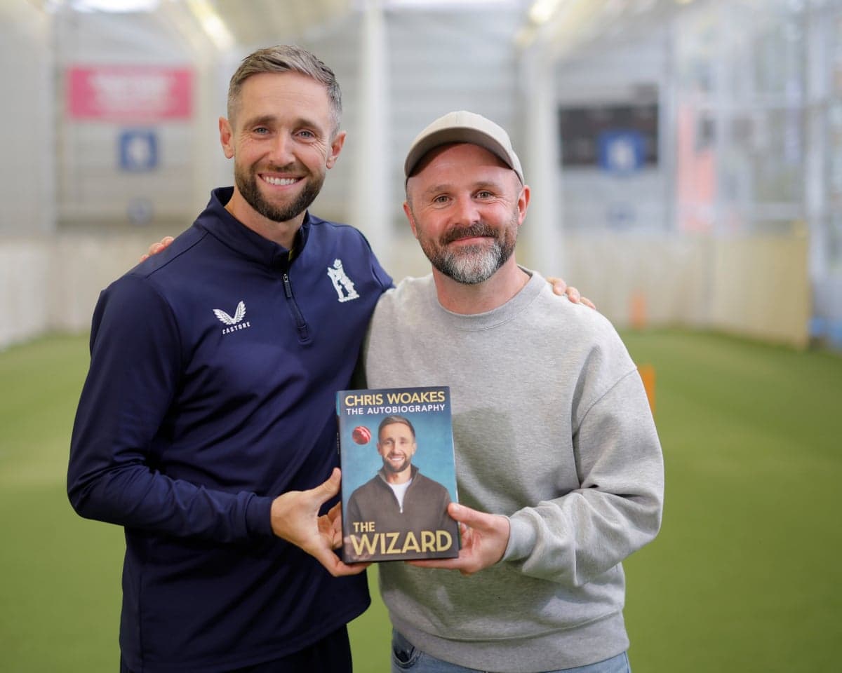 Chris Woakes and the Guardian’s Ali Martin with a copy of ‘The Wizard’, Woakes’s new autobiography