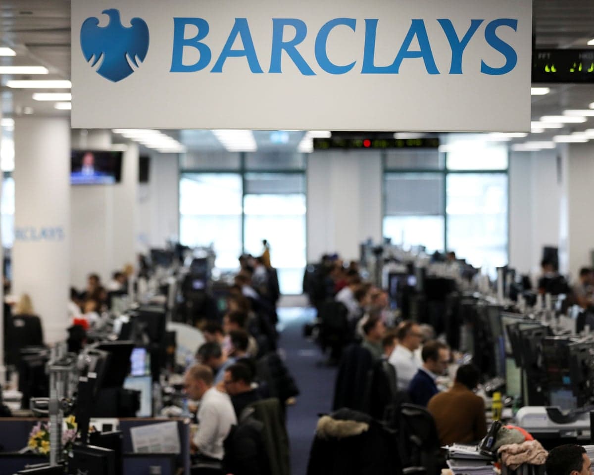 Traders work on the trading floor of Barclays Bank at Canary Wharf in London, in 2018.