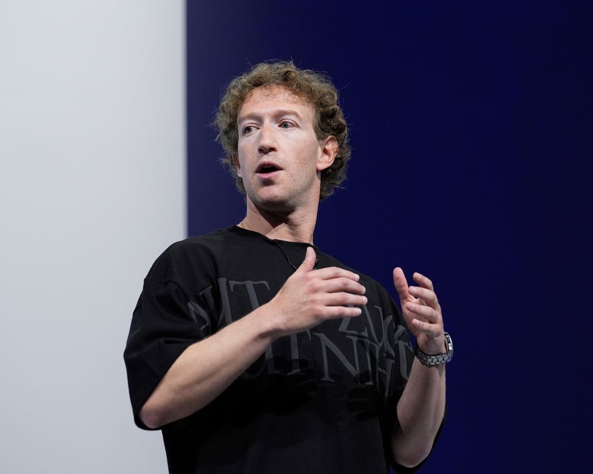 Zuckerberg gestures while speaking at a conference