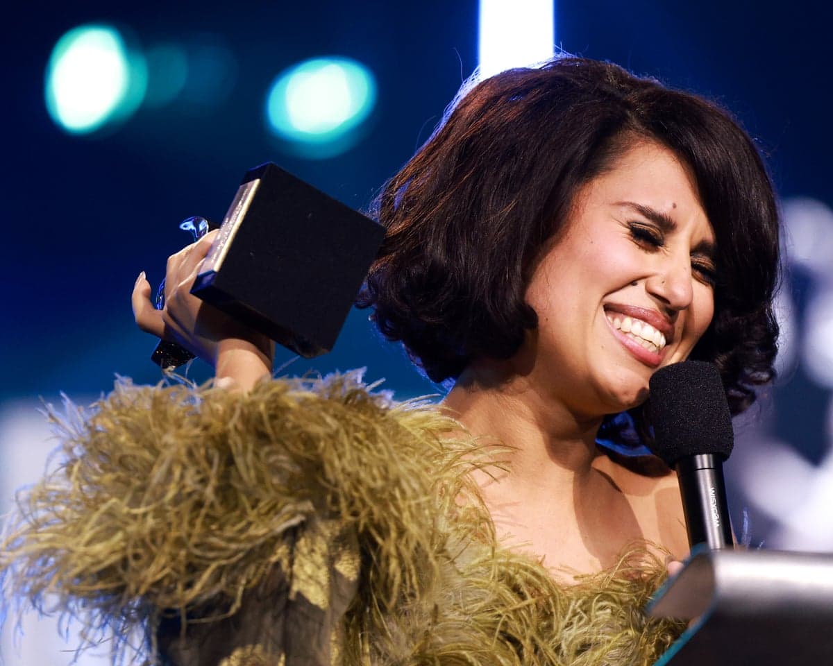 Raye accepts the 2026 Mercury prize.