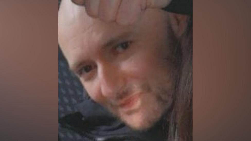 A close shot of a bald man