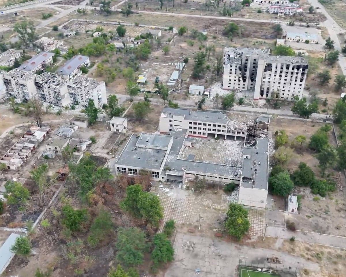 Aerial view of severely damaged, bombed-out buildings in Oleshky, Ukraine