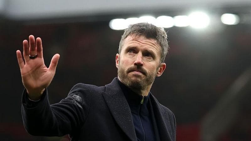 Michael Carrick waves to fans after Manchester United's defeat at home to Bournemouth