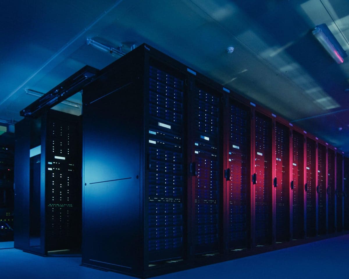 A data center with multiple rows of server racks.
