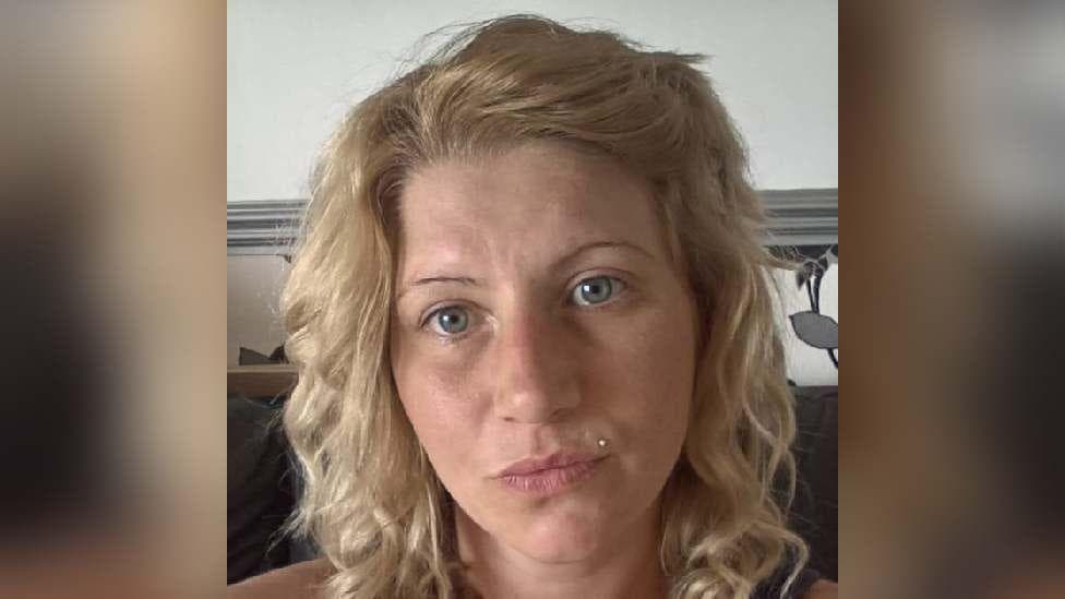 A selfie of Charlene Dowsell, who has light blonde curly hair and blue eyes.