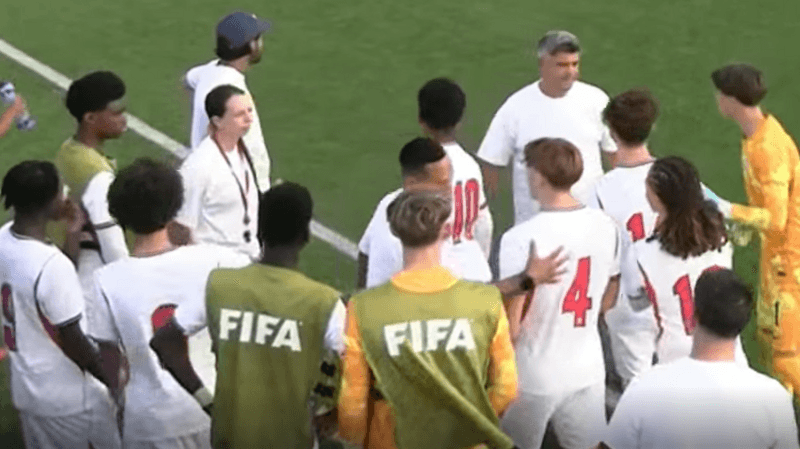 England Under-15 players gathered at the side of the pitch after a team-mate made an allegation of racism by a Republic of Ireland opponent