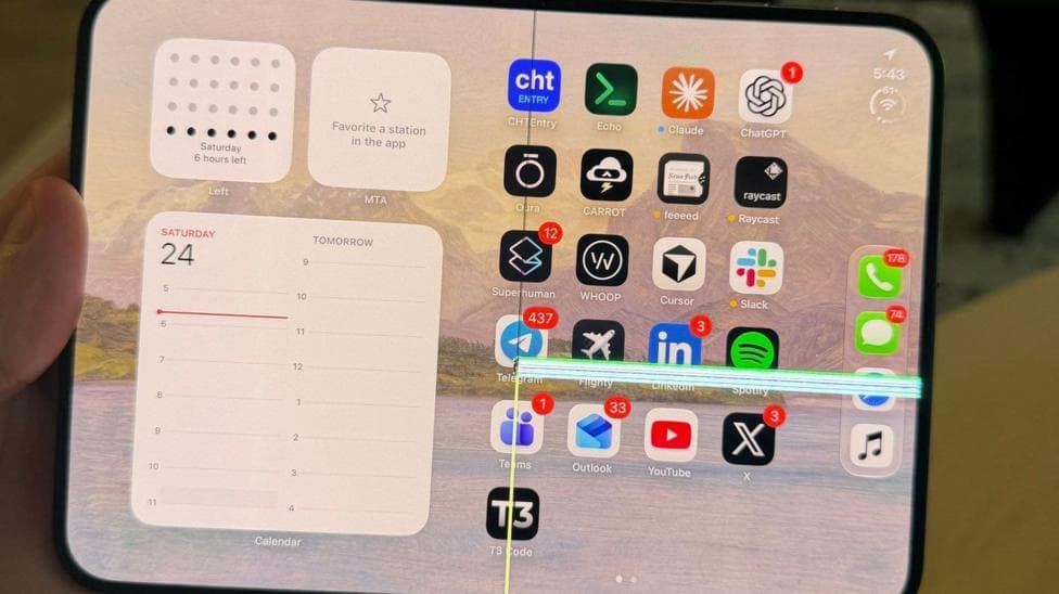 An image of an iPhone Duo with a faulty screen lines across the right side of the folding screen.