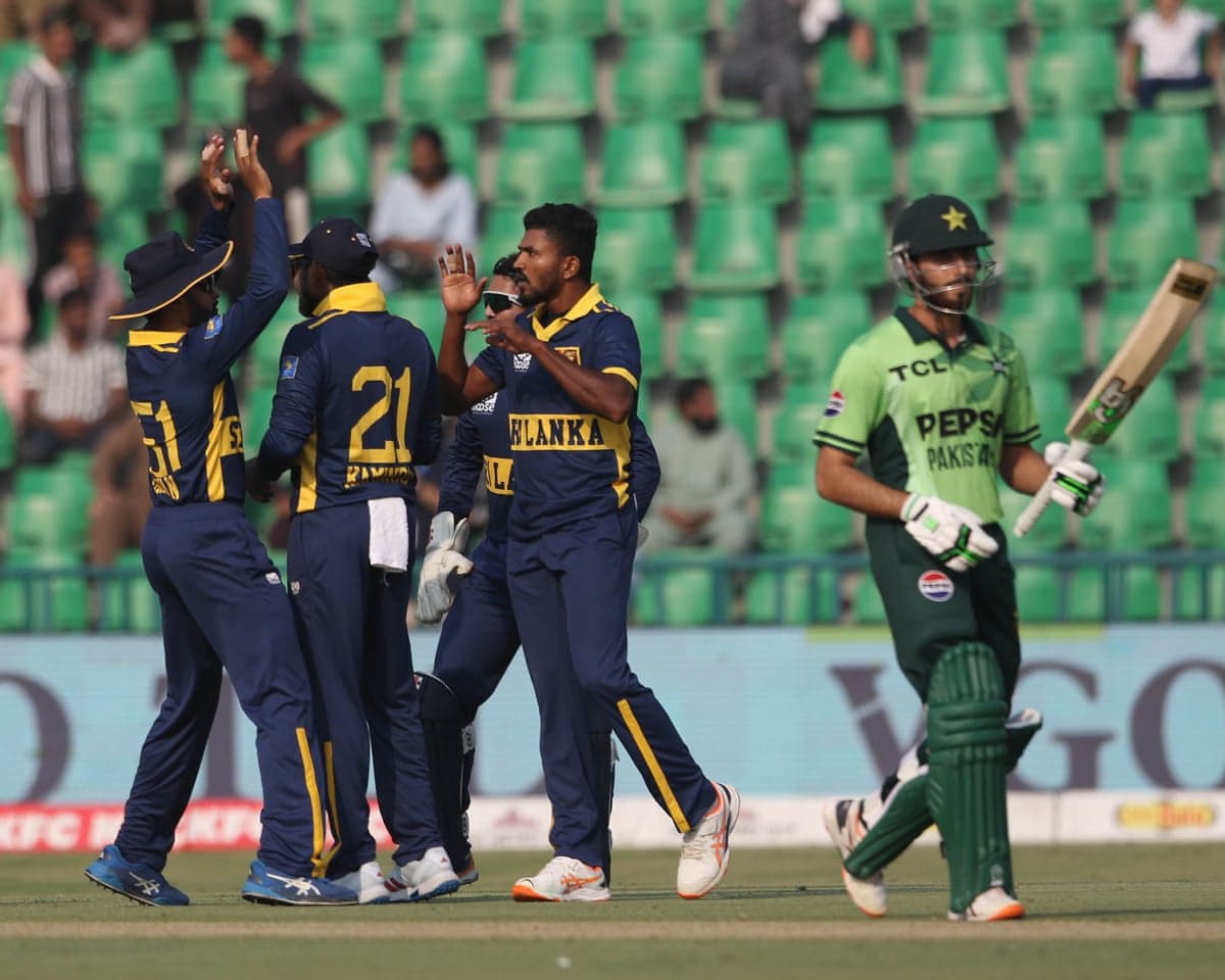 The Sri Lanka players celebrate after Dilshan Madushanka claims the wicket of Pakistan’s Arafat Minhas in Lahore