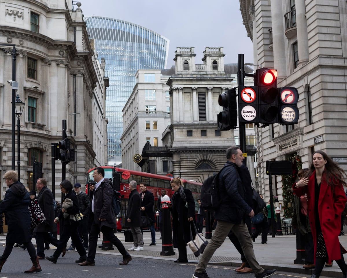 Workers crossing the street in the City of London