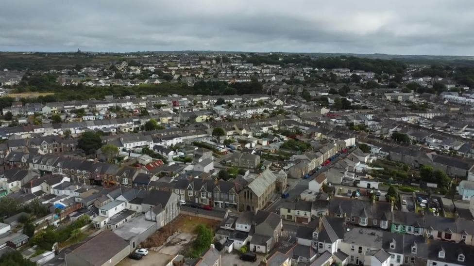 An aerial shot of Camborne in Cornwall, showing rows of houses