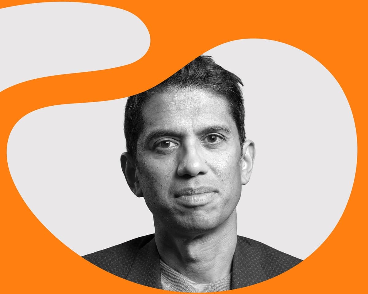 A headshot of Aditya Charkrabortty with curvy orange graphic