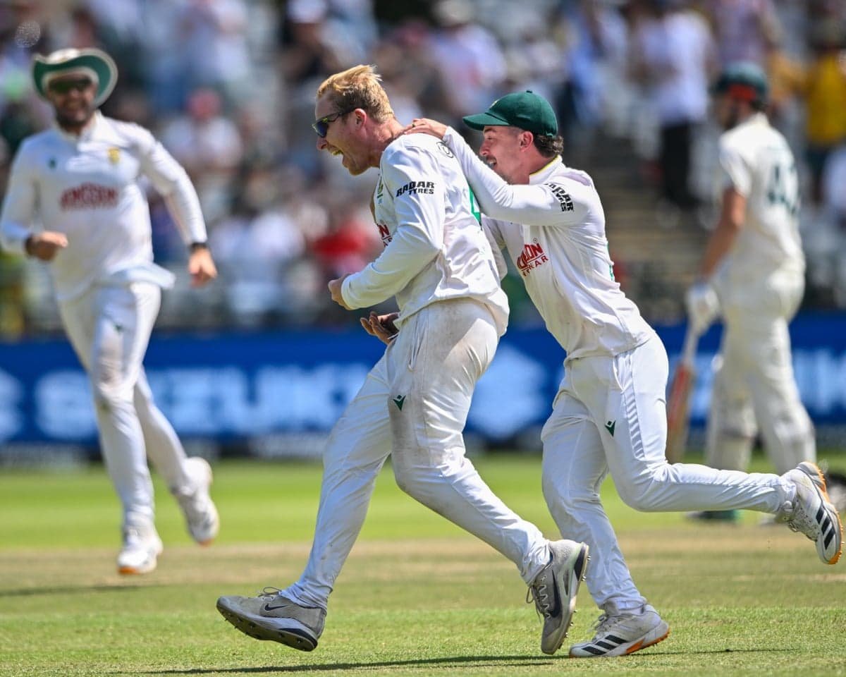 Simon Harmer celebrates after his sixth wicket secured South Africa's win over Australia in the third Test at Newlands.
