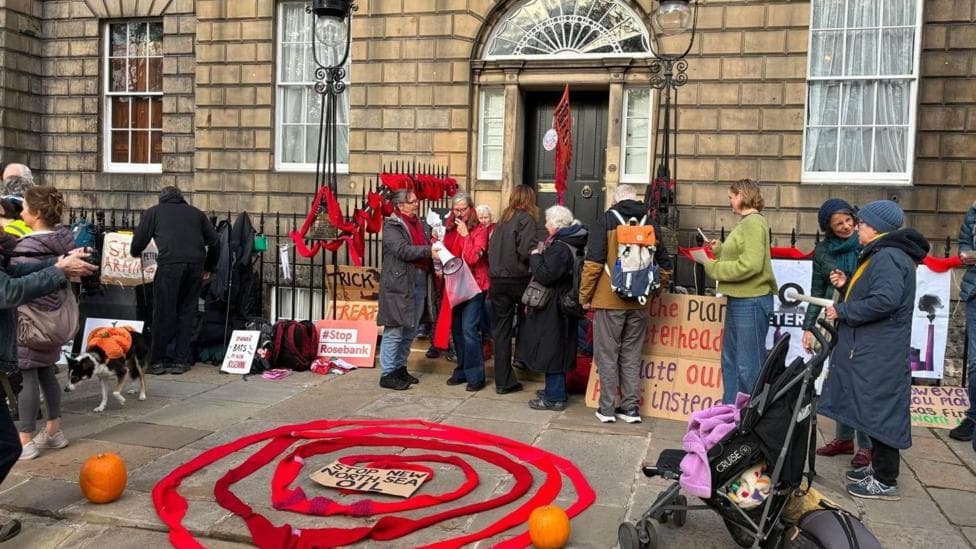 A small group of protestors outside Bute House.