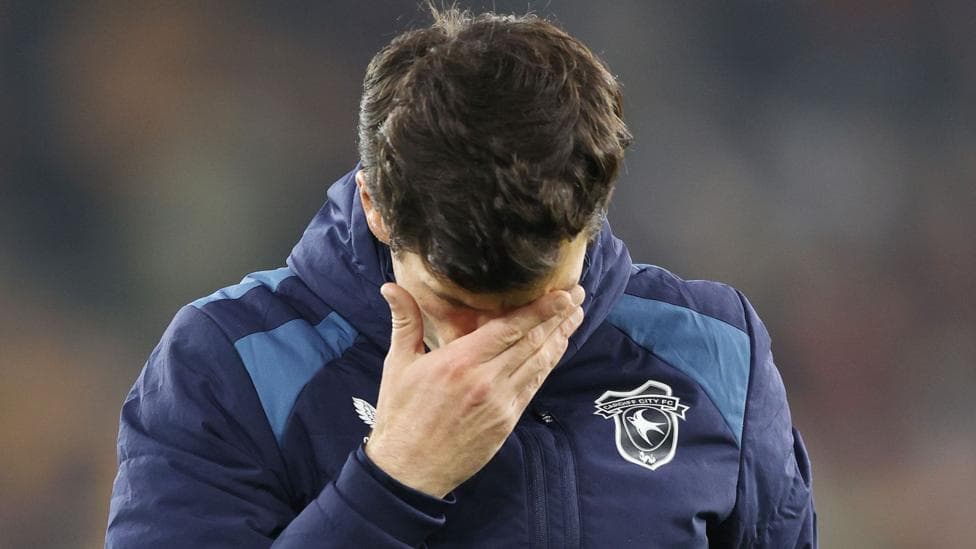 Brian Barry-Murphy covers eyes with his hands and looks down